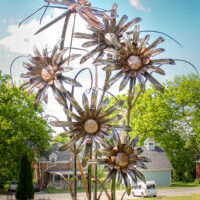 Steel sculpture of flowers and a dragonfly, from the Chelsea Sculpture Walk